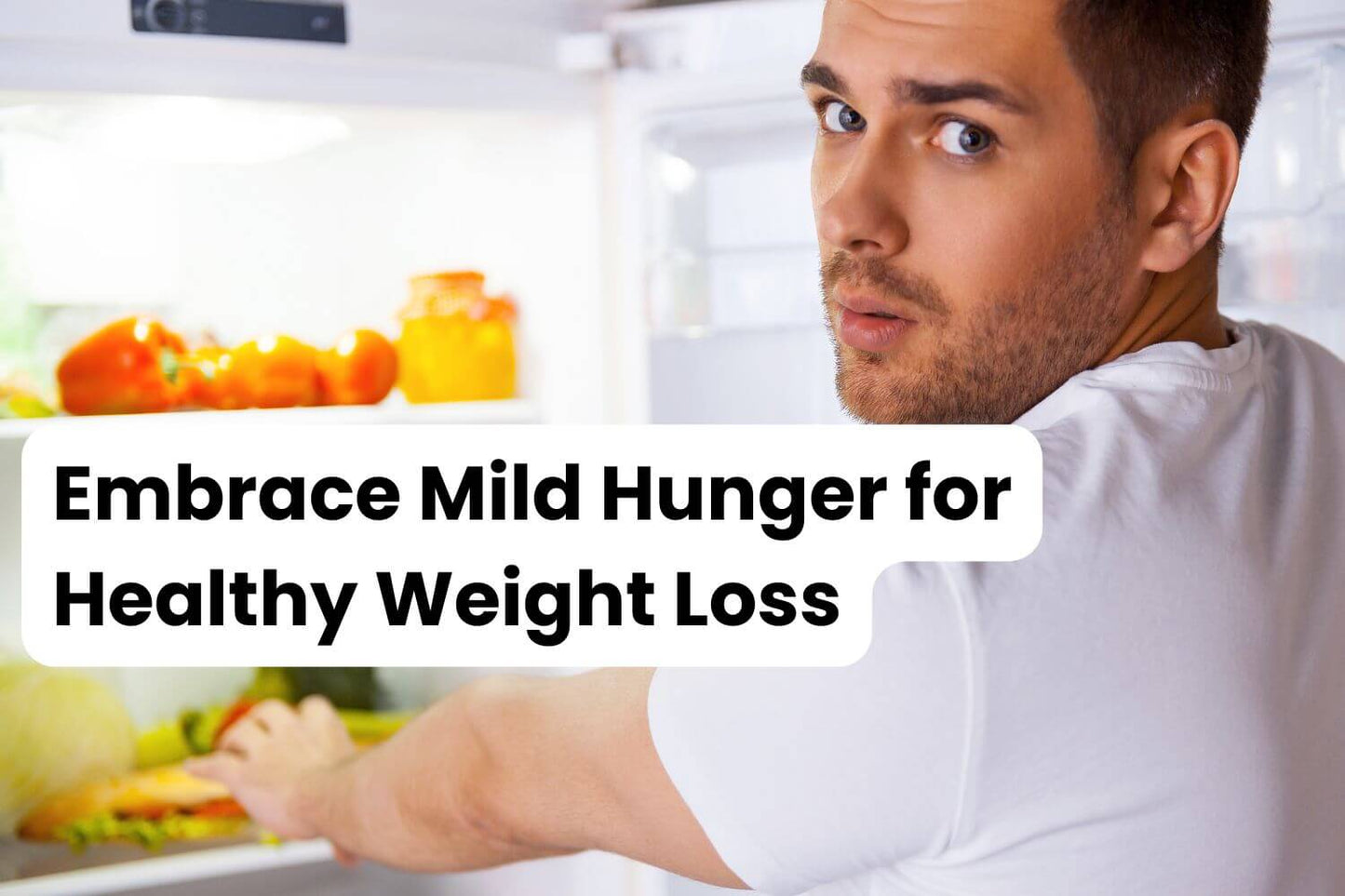 man reaching in the fridge to solve hunger when dieting